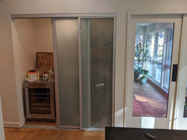 Wide back deck with architectural seating area