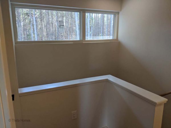 Garden pathway adjacent to custom home exterior