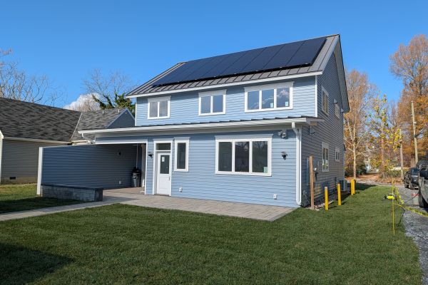 Exterior backyard view showing patio and custom home design