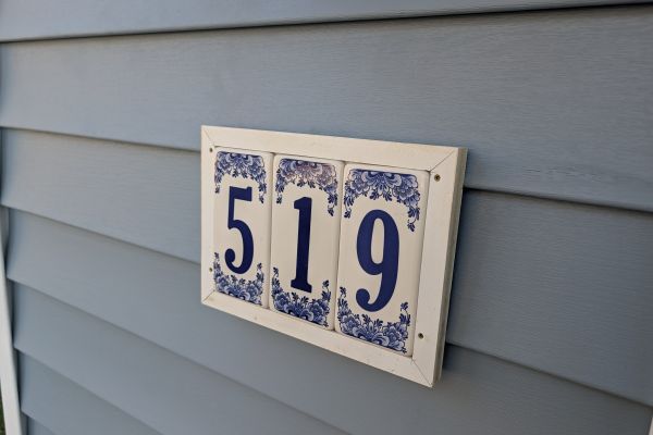 Evening shot of custom home with exterior lighting accents